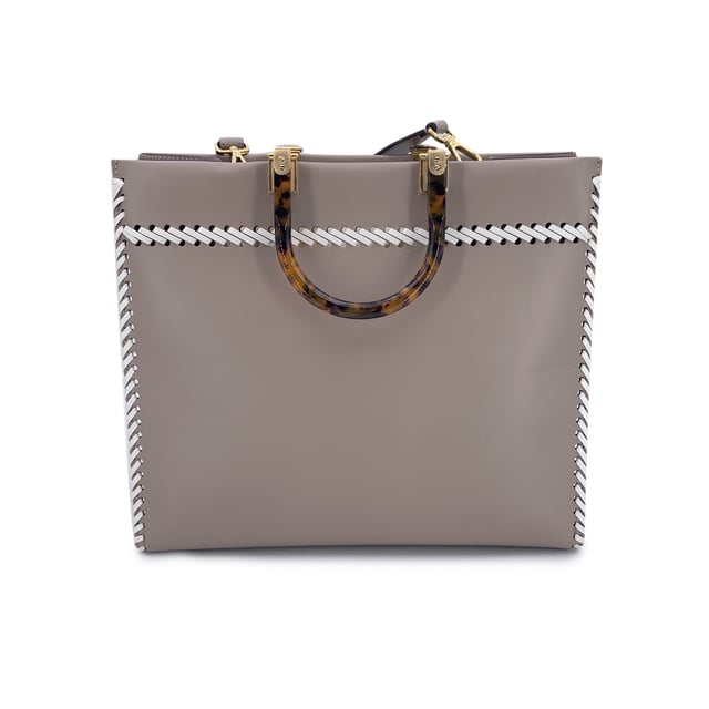 VINTAGE, RRP AS NEW
This beautiful item will come with a Certificate of ity provided by Entrupy. The certificate will be provided at no further cost  Sophisticated and striking, the FENDI Sunshine Medium Shopper Tote in Tortora taupe leather is a modern classic with a nod to vintage elegance. This iconic model blends clean Italian lines with statement-making Condition Rating: A - EXCELLENTCondition Details: Gently used. Minimal creases on leather along the borders. Please check the photos carefully and ask if you need to know more details or if you have any doubts.Measurements (cm):Depth: 15.2Height: 26.7Length: 35.6Other Details: Dustbag? NoKeys? NoBox? No Measurments:  width: 152 mm length: 356 mm height: 267 mm strap length: 0 mm handle drop: 0 mm