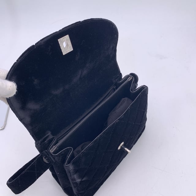 VINTAGE, RRP AS NEW
This beautiful Bag will come with a certificate of ity provided by third party ators. The certificate will be provided at no further cost  From the elegant runways of the late '90s comes this vintage Chanel single flap bag, crafted in sumptuous black quilted velvet, a texture that captures both light and attention with effortless grace. Dating from the 1996-1997 collection, this piece carries the spirit of an era when Chanel redefined quiet luxury with bold femininity.  The front flap is anchored by the iconic CC turn-lock clasp in silver-tone metal, a timeless emblem of the Maison's enduring legacy. the bag features 1 rear open pocket. Inside, the bag opens to reveal a black leather lining, elegantly divided into two main compartments, with one zippered pocket and one open side pocket - the perfect balance of form and function.  Every detail speaks to Chanel's meticulous craftsmanship, from the embossed 'CHANEL' and 'Made in France' markings inside to the discreet ity serial number that confirms its heritage.  More than a bag, this is a collector's keepsake - a velvet echo of '90s Parisian style, meant to be worn, admired, and passed on.  Condition Rating: B - VERY GOOD CONDITIONCondition Details: Gently used. The velvet on the studs that hold the shoulder strap is slightly worn. Minimal wear of use inside. Minimal wear of use on the flap, upper corner (some show arrows indicating any evident defect.). Please, see the photos and/or ask if you have any doubts or if you need more information.Measurements (cm):Depth: 8.9Height: 16.5Length: 24.1Other Details: Dustbag? YesKeys? NoBox? No Measurments:  width: 89 mm length: 241 mm height: 165 mm strap length: 0 mm handle drop: 0 mm