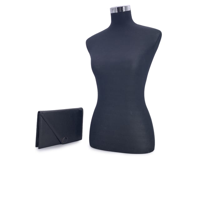 VINTAGE, RRP AS NEW
Step into timeless elegance with this Yves Saint Laurent vintage clutch bag, a true reflection of refined 1980s minimalism. Crafted in supple black leather, this piece blends classic sophistication with a subtle edge, thanks to its distinctive asymmetric flap design. The flap fastens securely with a magnetic button closure, revealing a neatly lined fabric interior complete with a side zip pocket-perfect for your essentials.  Inside, the iconic 'YVES SAINT LAURENT' name is embossed, a quiet reminder of the maison's heritage and craftsmanship. Understated yet unmistakably luxurious, this clutch is more than an accessory-it's a piece of fashion history, ready to accompany you on evenings out or cherished as part of a vintage collection. Condition Rating: A - EXCELLENTCondition Details: Gently used. Please check the photos carefully and ask if you need to know more details or if you have any doubts.Measurements (cm):Depth: 2.5Height: 17.8Length: 25.4Other Details: Dustbag? NoKeys? NoBox? No Measurments:  width: 25 mm length: 254 mm height: 178 mm strap length: 0 mm handle drop: 0 mm