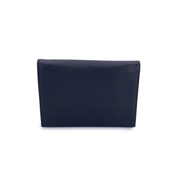 VINTAGE, RRP AS NEW
Step into timeless elegance with this Yves Saint Laurent vintage clutch bag, a true reflection of refined 1980s minimalism. Crafted in supple black leather, this piece blends classic sophistication with a subtle edge, thanks to its distinctive asymmetric flap design. The flap fastens securely with a magnetic button closure, revealing a neatly lined fabric interior complete with a side zip pocket-perfect for your essentials.  Inside, the iconic 'YVES SAINT LAURENT' name is embossed, a quiet reminder of the maison's heritage and craftsmanship. Understated yet unmistakably luxurious, this clutch is more than an accessory-it's a piece of fashion history, ready to accompany you on evenings out or cherished as part of a vintage collection. Condition Rating: A - EXCELLENTCondition Details: Gently used. Please check the photos carefully and ask if you need to know more details or if you have any doubts.Measurements (cm):Depth: 2.5Height: 17.8Length: 25.4Other Details: Dustbag? NoKeys? NoBox? No Measurments:  width: 25 mm length: 254 mm height: 178 mm strap length: 0 mm handle drop: 0 mm