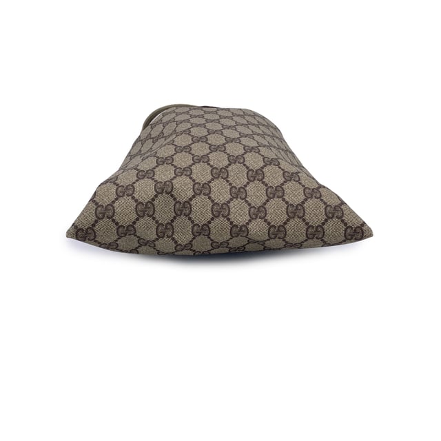 VINTAGE, RRP AS NEW
A charming relic from the golden era of Gucci, this Vintage Multipurpose Pouch is a testament to the brand's timeless appeal and practical elegance. Crafted in classic beige GG monogram canvas, it embodies the effortless style that defined the Gucci Accessory Collection-a line beloved by collectors for its functional beauty and signature flair.  The pouch features a drawstring closure, lending it a soft, relaxed silhouette while keeping your essentials secure. A GG logo patch on the front adds a subtle yet iconic touch, perfectly pairing with the understated canvas lining inside. Tucked within, the original 'Gucci Accessory Collection - Made in Italy' tag marks its vintage roots.  Compact, lightweight, and endlessly versatile, this piece is ideal as a travel companion, cosmetic holder, or casual clutch. For lovers of vintage Gucci, it's a small but storied find-full of character, charm, and history. Condition Rating: B - VERY GOOD CONDITIONCondition Details: Gently used. Light scratches on leather logo patch. Please check the photos carefully and ask if you need to know more details or if you have any doubts.Measurements (cm):Depth: n.a.Height: 33.0Length: 22.9Other Details: Dustbag? NoKeys? NoBox? No Measurments:  length: 229 mm height: 330 mm strap length: 0 mm handle drop: 0 mm