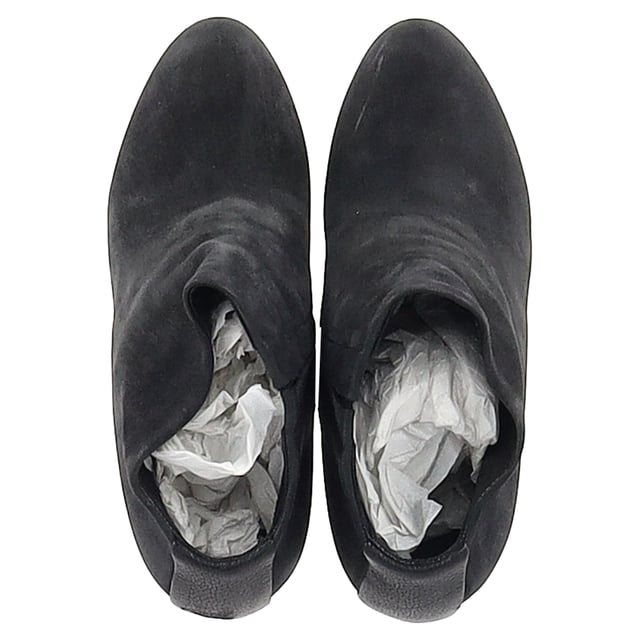 VINTAGE, RRP AS NEW
 Command attention with the Balenciaga Wedge Ankle Boots in black suede, merging sleek sophistication with architectural edge. The sculptural wedge heel and soft suede finish create a bold yet refined silhouette perfect for day-to-night wear. **Style Tip:** Style them with a midi skirt and structured blazer for a chic, contemporary twist on classic tailoring.

Balenciaga Wedge Ankle Boots in Black Suede

Condition: Good
Signs of wear: Moderate signs of wear or markings, moderate scuffing insoles., Used but well maintained. Moderate creasing and marks at surface, wear at soles or replaced soles.
Packaging: None
Color: Black
Material: Suede | suede
Size: IT | 38.5
Measurements: Heel height: 125; Insole length: 255
SKU: BAPUGBSH508323W