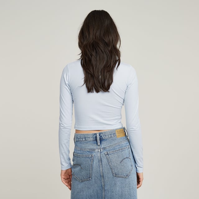Mock neck. G-STAR print at the chest. Woven G-STAR Originals label at the lower side seam. No closure. Mock top Cropped is cut in a superslim fit and offers a short length. The sleeves are kept slightly longer. 95% Organic cotton, 5% Elastane. Super stretch. Jersey knit. Super Slim