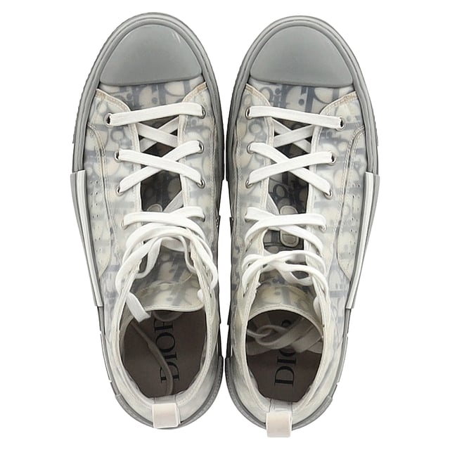 VINTAGE, RRP AS NEW
 Step up your sneaker game with the Dior B23 League High-Top Sneakers, crafted in crisp white canvas and detailed with tonal Dior branding for a clean, contemporary finish. The high-top silhouette and rubber sole offer both comfort and urban-chic appeal. **Style tip:** Pair them with cropped trousers or a flowy midi dress to add a sporty-luxe twist to your everyday look.

Dior B23 League High-Top Sneakers in White Canvas

Condition: Very good
Signs of wear: Include Box., Minor markings, Lightly used but very well maintained. Minor mark at soles & creasing, light scuffing at the soles and heels.
Packaging: Box
Color: White
Material: Canvas 
Size: EU | 42
Measurements: Heel height: 40; Insole length: 310
SKU: NAPPUGBSH524329W