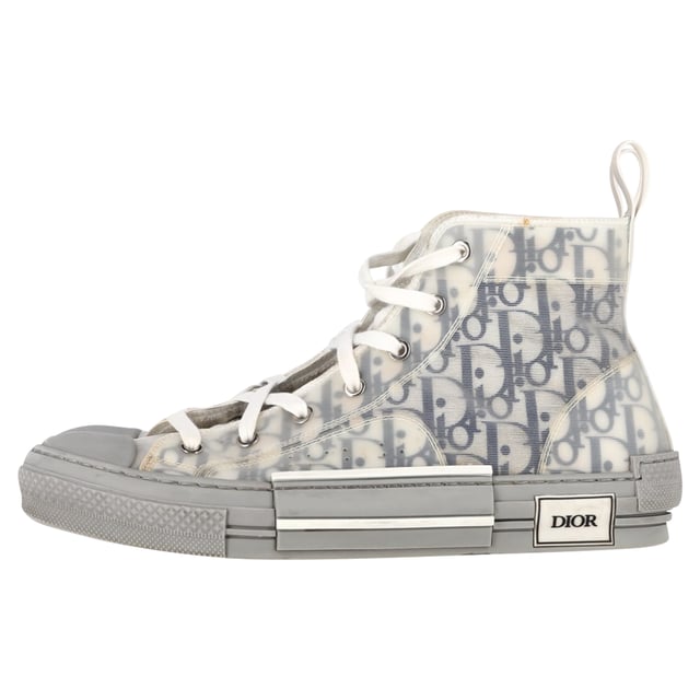 VINTAGE, RRP AS NEW
 Step up your sneaker game with the Dior B23 League High-Top Sneakers, crafted in crisp white canvas and detailed with tonal Dior branding for a clean, contemporary finish. The high-top silhouette and rubber sole offer both comfort and urban-chic appeal. **Style tip:** Pair them with cropped trousers or a flowy midi dress to add a sporty-luxe twist to your everyday look.

Dior B23 League High-Top Sneakers in White Canvas

Condition: Very good
Signs of wear: Include Box., Minor markings, Lightly used but very well maintained. Minor mark at soles & creasing, light scuffing at the soles and heels.
Packaging: Box
Color: White
Material: Canvas 
Size: EU | 42
Measurements: Heel height: 40; Insole length: 310
SKU: NAPPUGBSH524329W