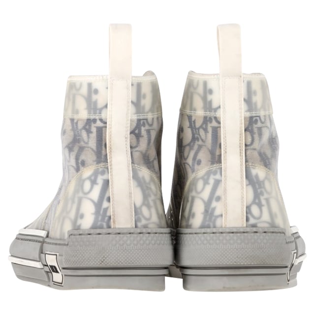 VINTAGE, RRP AS NEW
 Step up your sneaker game with the Dior B23 League High-Top Sneakers, crafted in crisp white canvas and detailed with tonal Dior branding for a clean, contemporary finish. The high-top silhouette and rubber sole offer both comfort and urban-chic appeal. **Style tip:** Pair them with cropped trousers or a flowy midi dress to add a sporty-luxe twist to your everyday look.

Dior B23 League High-Top Sneakers in White Canvas

Condition: Very good
Signs of wear: Include Box., Minor markings, Lightly used but very well maintained. Minor mark at soles & creasing, light scuffing at the soles and heels.
Packaging: Box
Color: White
Material: Canvas 
Size: EU | 42
Measurements: Heel height: 40; Insole length: 310
SKU: NAPPUGBSH524329W