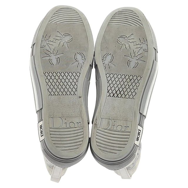 VINTAGE, RRP AS NEW
 Step up your sneaker game with the Dior B23 League High-Top Sneakers, crafted in crisp white canvas and detailed with tonal Dior branding for a clean, contemporary finish. The high-top silhouette and rubber sole offer both comfort and urban-chic appeal. **Style tip:** Pair them with cropped trousers or a flowy midi dress to add a sporty-luxe twist to your everyday look.

Dior B23 League High-Top Sneakers in White Canvas

Condition: Very good
Signs of wear: Include Box., Minor markings, Lightly used but very well maintained. Minor mark at soles & creasing, light scuffing at the soles and heels.
Packaging: Box
Color: White
Material: Canvas 
Size: EU | 42
Measurements: Heel height: 40; Insole length: 310
SKU: NAPPUGBSH524329W
