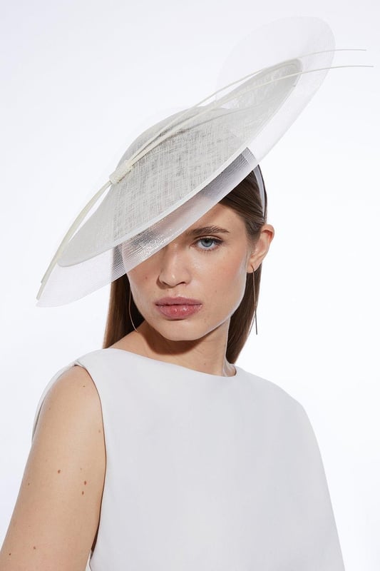 Showcasing an innovative combination of pleated mesh and spiral details, this fascinator adds an elegant finishing touch to occasionwear ensembles.Browse this seasons women's fascinators or discover the full range of women's accessories now.