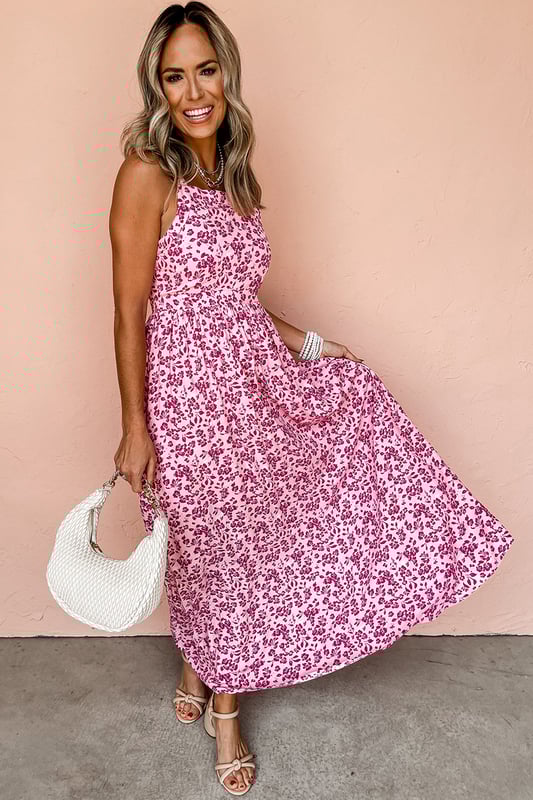 Blumenmuster für ein Frühlings- und Sommerfeeling  
Empire-Taillendesign betont die Kurven  
Sexy Ausschnitt auf der Rückseite  
Ärmellos für einen eleganten Sommerlook  
Material: 100 % Polyester