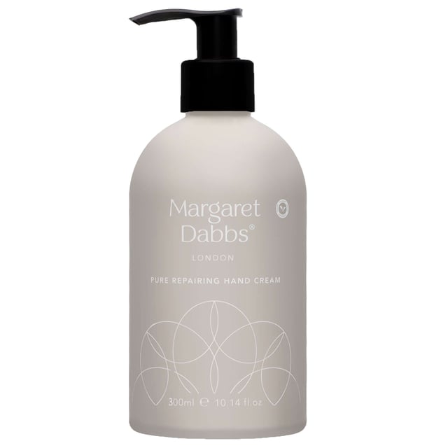 Experience the luxurious Margaret Dabbs London Pure Repairing Hand Cream, designed for intense hydration and skin renewal. This award-winning cream features a unique moisture delivery system that creates a continuous water reservoir within your skin, ensuring deep hydration for up to 72 hours. Infused with the delightful scents of Rose and Lemon, it combines powerful botanicals to rejuvenate fine and fragile skin. Free from harmful chemicals and preservatives, it's perfect for hands showing signs of ageing and damage. Simply massage into hands for a nourishing treatment.