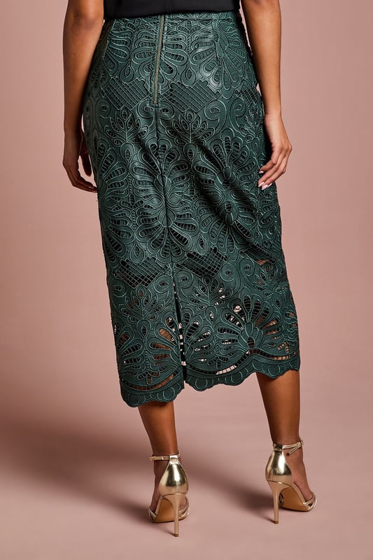 Luxurious PU midi skirt featuring intricate lace overlay with botanical pattern
        Elegant scalloped hem detail adds a refined finishing touch
        Figure-flattering silhouette with a sophisticated midi length
        Designed specifically for petite frames for perfect proportions
        Semi-sheer lace detailing creates a striking textural contrast
    
    This exquisite Petite PU Lace Midi Skirt from Coast combines contemporary style with timeless elegance. The striking botanical lace overlay creates a captivating visual texture whilst the scalloped hem adds a touch of femininity to this sophisticated piece. Perfect for special occasions, this skirt pairs beautifully with a simple silk camisole and strappy metallic heels as shown for a wedding guest ensemble that commands attention. For race day events, complement with a tailored blazer and fascinator for a look that balances tradition with modern flair. The midi length is particularly flattering on petite frames, whilst the PU fabrication offers structure and durability. This versatile piece transitions effortlessly from formal daytime events to evening soires, making it a valuable addition to your occasion wardrobe.