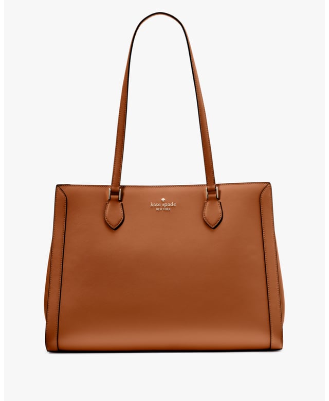 Stay Organized On The Go With Our Madison Laptop Tote. Stylish And Practical, It's Crafted From Durable Saffiano Leather With A Sleek East-West Design. Plus, It Features Multiple Pockets For Essentials Like A Laptop, Wallet And More., Madison Saffiano Leather East West Leather Laptop Tote, Metal Pinmount With Logo, Back Zip And Front Slip Pockets, Middle Zip Compartment,  Length: 17.00 Cm,  Width: 28.50 Cm,  Height: 39.50 Cm