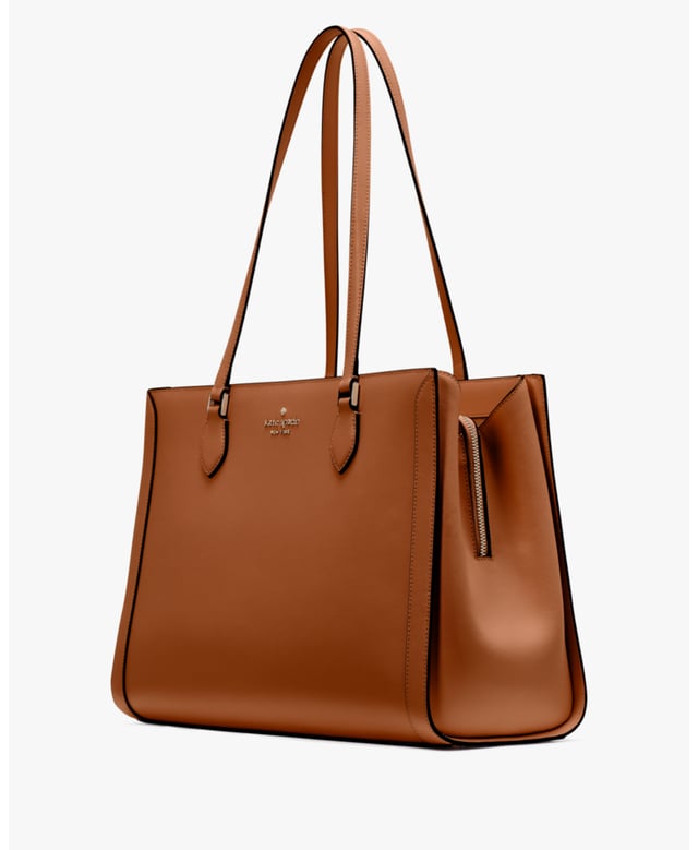 Stay Organized On The Go With Our Madison Laptop Tote. Stylish And Practical, It's Crafted From Durable Saffiano Leather With A Sleek East-West Design. Plus, It Features Multiple Pockets For Essentials Like A Laptop, Wallet And More., Madison Saffiano Leather East West Leather Laptop Tote, Metal Pinmount With Logo, Back Zip And Front Slip Pockets, Middle Zip Compartment,  Length: 17.00 Cm,  Width: 28.50 Cm,  Height: 39.50 Cm