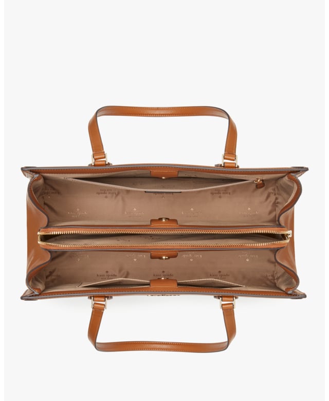 Stay Organized On The Go With Our Madison Laptop Tote. Stylish And Practical, It's Crafted From Durable Saffiano Leather With A Sleek East-West Design. Plus, It Features Multiple Pockets For Essentials Like A Laptop, Wallet And More., Madison Saffiano Leather East West Leather Laptop Tote, Metal Pinmount With Logo, Back Zip And Front Slip Pockets, Middle Zip Compartment,  Length: 17.00 Cm,  Width: 28.50 Cm,  Height: 39.50 Cm