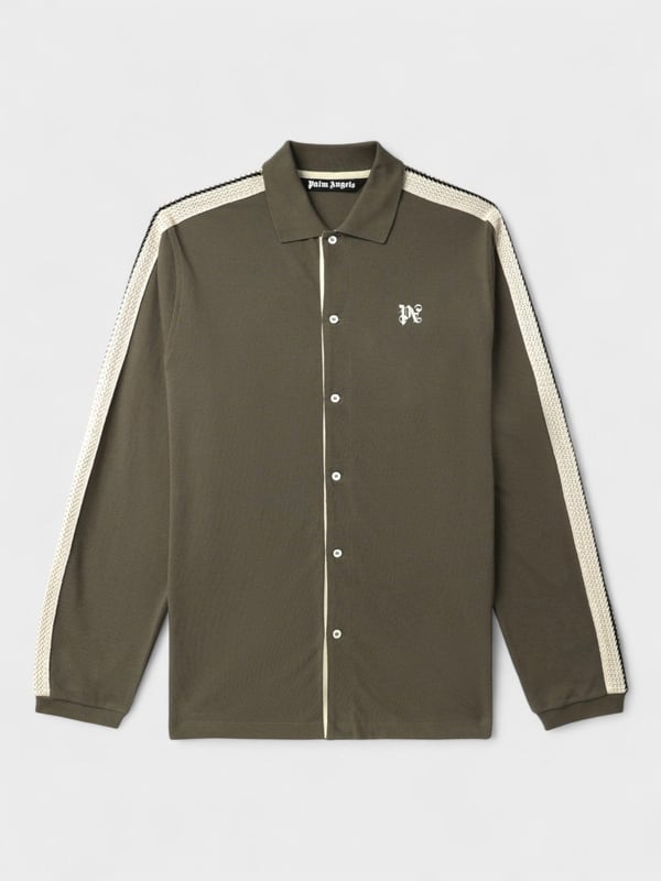 Elevate your wardrobe with the Palm Angels Monogram Embroidered Cotton Shirt. Meticulously crafted from premium cotton, this sophisticated piece showcases the iconic Palm Angels monogram embroidery, symbolizing contemporary luxury. The impeccable tailoring and refined details make this shirt a versatile statement piece for the discerning gentleman who appreciates subtle elegance and exceptional craftsmanship.
PMBD046E23JER0016003