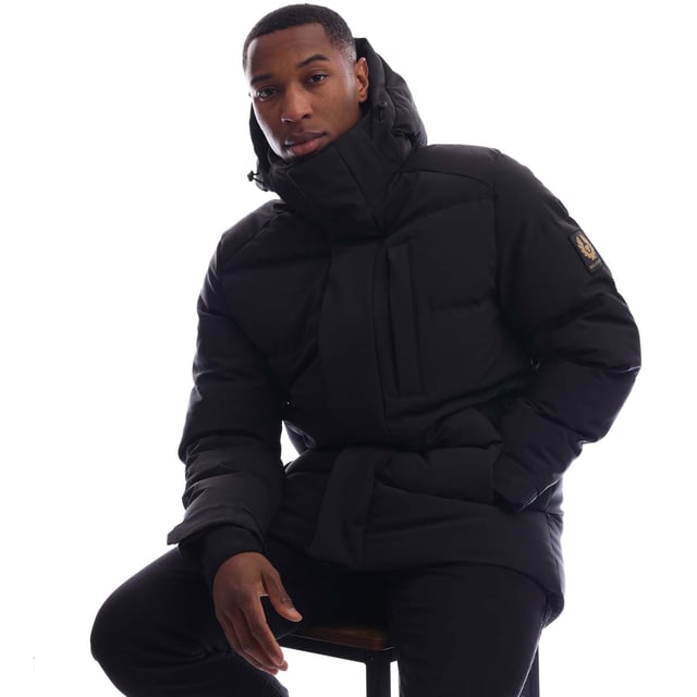 Mens Belstaff Pendulum Down Jacket in black.- Adjustable drawcord hood.- Double centre front zip fastening  snap button placket.- Two side pockets  internal pocket.- Adjustable storm cuffs with thumbholes.- Adjustable drawcord hem.- Fleece-lined chin guard.- Belstaff silicone logo on placket and cuffs  woven logo on sleeve.- Water-repellent padded.- 3-Layer Stretch Down.- 90% Polyester  10% Elastane.- Ref: 105314BLACK