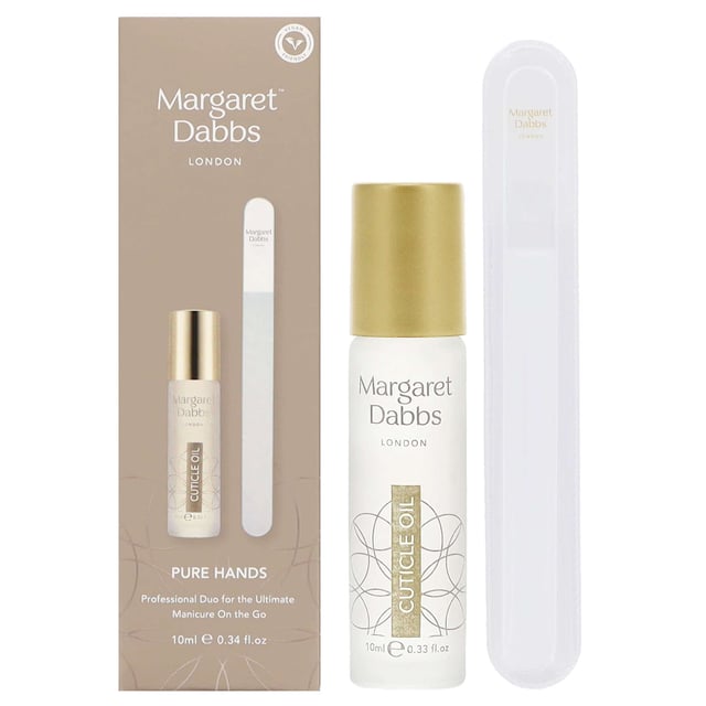Experience the ultimate manicure with the Margaret Dabbs London Pure Professional Duo. This set includes a 10ml Cuticle Oil and a Small Crystal Nail File, perfect for maintaining beautiful nails anywhere. The vegan-friendly cuticle oil hydrates, soothes, and protects your nails with a nourishing blend of Jojoba and Borage Seed oils, while bisabolol calms sensitive skin and repairs damaged cuticles. The Crystal Nail File promotes healthy nail growth and prevents splitting, making it an essential tool for your nail care routine. Enjoy visibly stronger nails with a beautiful finish.