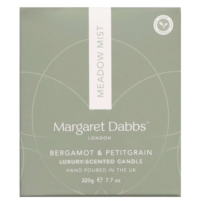 Margaret Dabbs London Meadow Mist Candle with Bergamot & Petitgrain 220g Immerse your space in the enchanting scent of spring with the Margaret Dabbs London Meadow Mist Candle. This 220g candle captures the essence of a wild meadow, featuring refreshing notes of Bergamot and earthy Petitgrain, complemented by delicate floral hints. Enjoy up to 40 hours of this delightful fragrance, crafted from 100% vegan-friendly, natural soy wax, ensuring it is GMO and additive-free. Handmade in the UK, each candle is elegantly poured into a recyclable and refillable glass container, making it a perfect eco-friendly addition to your home.