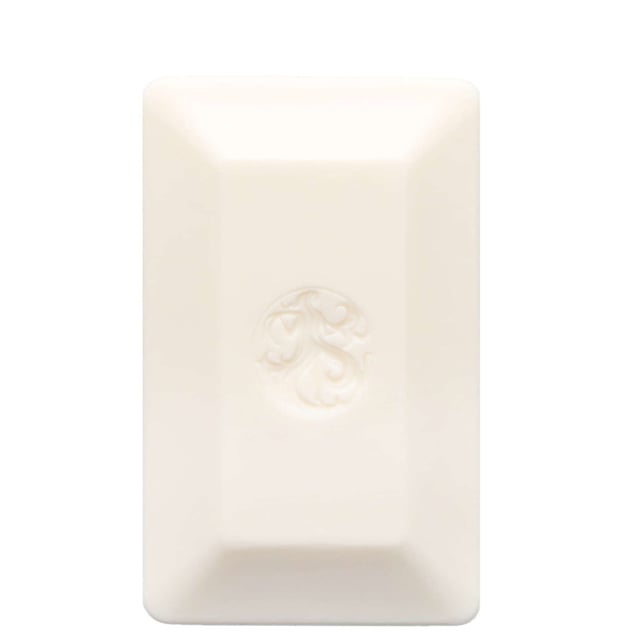 Indulge your senses with the Oribe Valley of Flowers Soap Bar, a luxurious 198g fragrance-infused soap designed for women. This exquisite soap offers a refreshing way to cleanse your skin while enveloping you in a delightful floral aroma. Enjoy the top notes of bright pomelo, bergamot, and blue violet, followed by a heart of Bulgarian rose, white peony, and jasmine. The soothing base notes of warm amber, sandalwood, and musk create a perfect finish. Simply apply to damp skin and massage for a rejuvenating experience.
