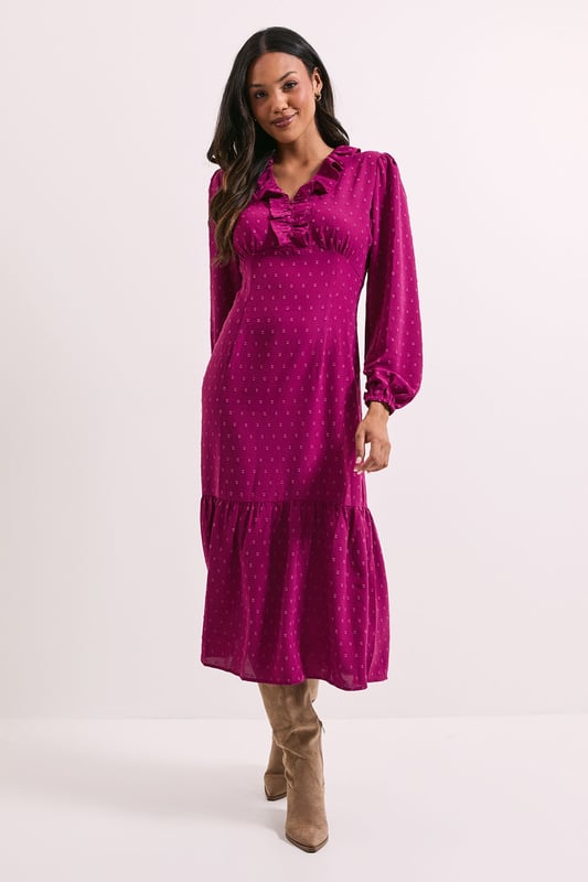 Elegant chiffon midi dress with delicate all-over pattern
        Feminine frill detail adorning the neckline for a sophisticated touch
        Flattering ruched bodice that enhances your silhouette
        Long sleeves with gentle volume for a graceful look
        Tiered hem detail adding movement and dimension to the dress
    
    This charming Dorothy Perkins midi dress combines comfort with effortless style for your everyday wardrobe. The ruched bodice creates a flattering fit while the frilled neckline adds a touch of femininity to the classic crew neck design. The flowing chiffon fabric drapes beautifully, with the tiered hem creating a graceful silhouette that moves with you. Style with ankle boots as shown for casual brunches with friends, or dress up with block heels for family gatherings and baby showers. The versatile design works wonderfully for daytime events when you want to look put-together without appearing overdressed. Layer with a cropped cardigan when the temperature drops, or add simple gold jewellery to enhance the dress's elegant appeal. This piece strikes the perfect balance between trend-conscious and timelessly wearable.