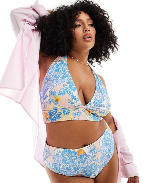 ASOS DESIGN Curve Hailey high apex triangle bikini top in baroque Swimwear & Beachwear by ASOS Curve Holiday countdown starts here All-over print Halterneck style Clasp closureSold By: Asos