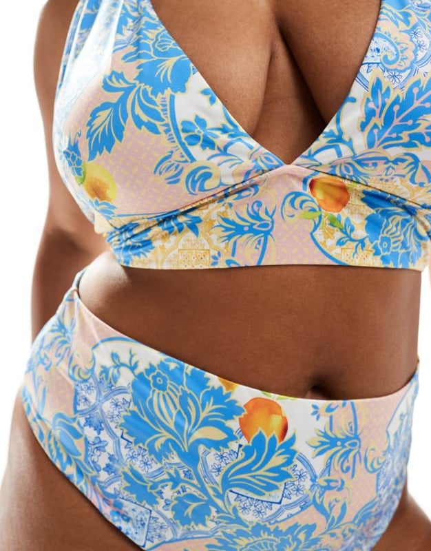 ASOS DESIGN Curve Hailey high apex triangle bikini top in baroque Swimwear & Beachwear by ASOS Curve Holiday countdown starts here All-over print Halterneck style Clasp closureSold By: Asos