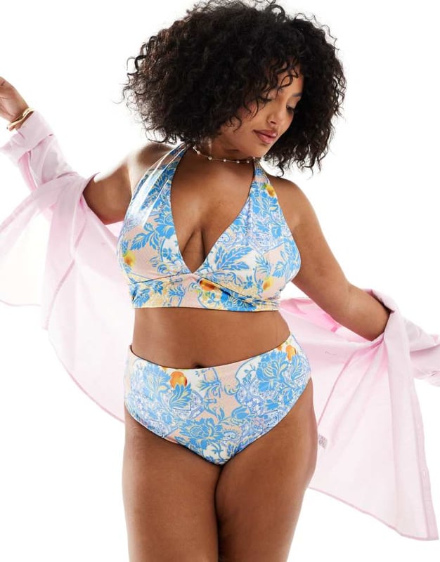 ASOS DESIGN Curve Hailey high apex triangle bikini top in baroque Swimwear & Beachwear by ASOS Curve Holiday countdown starts here All-over print Halterneck style Clasp closureSold By: Asos