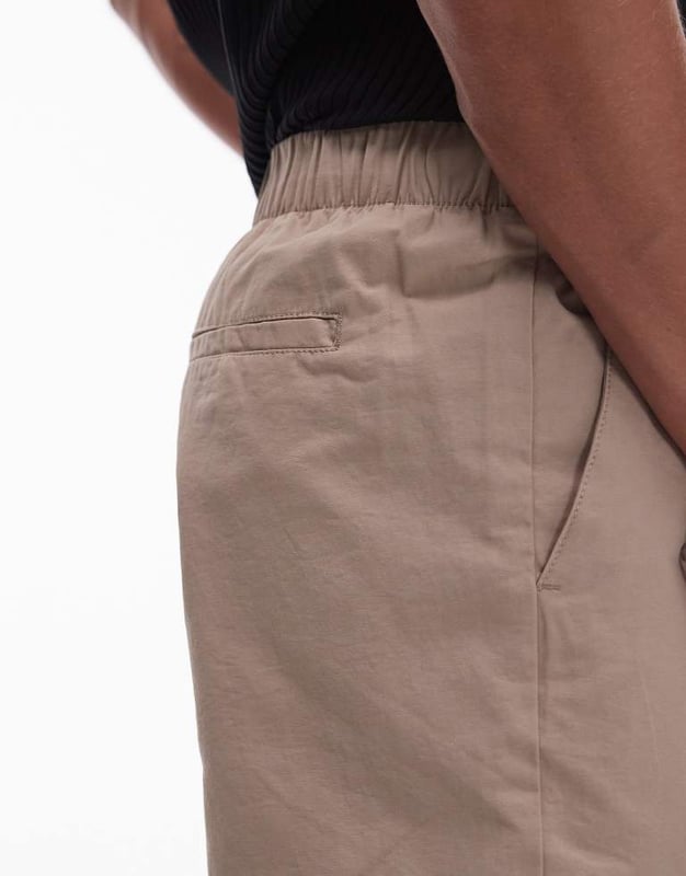 Trousers & Chinos by Topman This is Topman Mid rise Elasticated waistband Concealed fly Side pockets Regular, tapered fitSold By: Asos