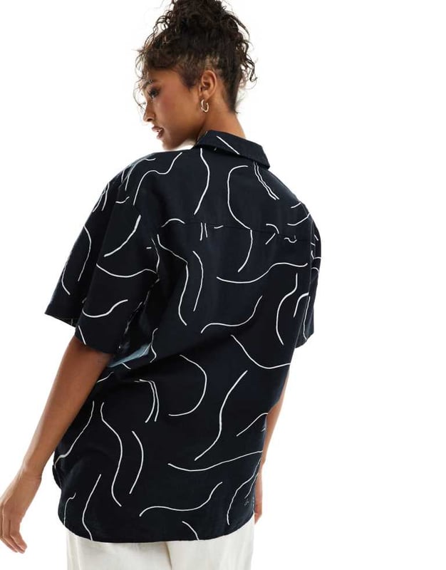 ASOS DESIGN oversized shirt with linen in mono print co-ord Tops by ASOS DESIGN *Saves to inspo folder* Abstract design Spread collar Button placket Oversized fitSold By: Asos