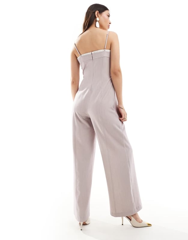 ASOS DESIGN contrast panel wide leg jumpsuit in stone Jumpsuits & Playsuits by ASOS DESIGN Minimal effort, maximum payoff Square neck Adjustable straps Contrast trim Zip-back fastening Wide leg Regular fitSold By: Asos