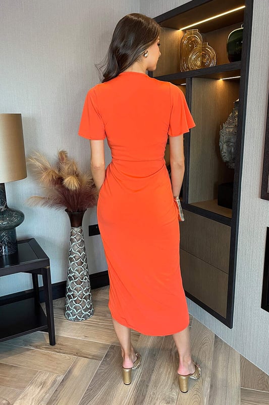 Burnt Orange Short Sleeve Ring Detail Wrap Midi Dress Our Burnt Orange Short Sleeve Ring Detail Wrap Midi Dress is an occasion wardrobe must have. Featuring our premium lined stretch jersey fabric, a V-shaped wrap neckline with inner rubber facing, an elasticated back waist, butterfly sleeves, waist O-ring detail and a midi wrap skirt. Pair with some cute heels and statement earrings for you next event. Model wears: UK 8/ EU 36/ US 4 Model's height: 173cm/ 5'8" Approx length from centre back to hem: 132 cm Fabric composition: 100% Polyester Colour: BURNT ORANGE