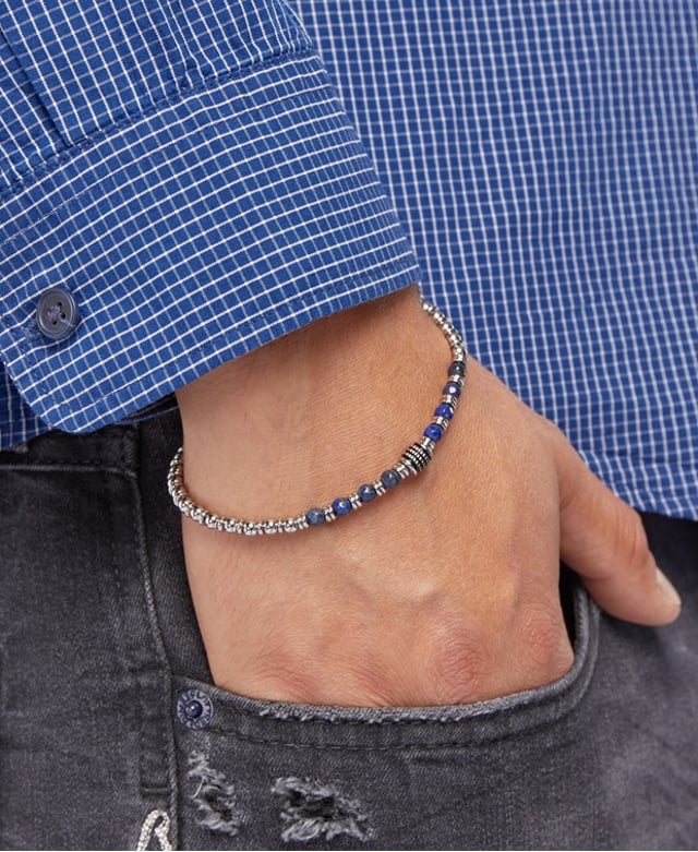 20 cm lange roestvrijstalen armband met lapis lazuli-stenen en stalen stoppers. Gepersonaliseerd label met logo.