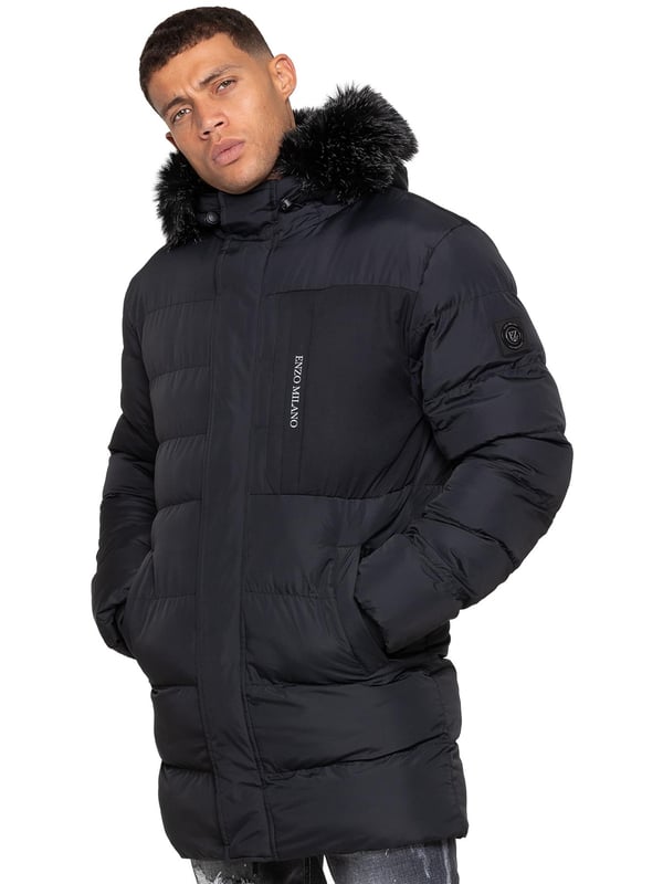 Stay warm and protected with the Enzo Milano Men’s Longline Puffer Jacket, crafted from smooth water-resistant poly fabric and insulated with synthetic fill for lasting comfort. Designed with a detachable faux fur trim and a faux fur-lined hood. The chest print and signature metal badge on the arm add premium detailing, while multiple zip pockets – including waist, chest, and inner options – keep your essentials secure. A drawcord hood with adjustable toggle, ribbed cuffs, and a full zip fastening with popper buttons provide extra protection against wind and rain, making this longline puffer your ultimate cold-weather essential.