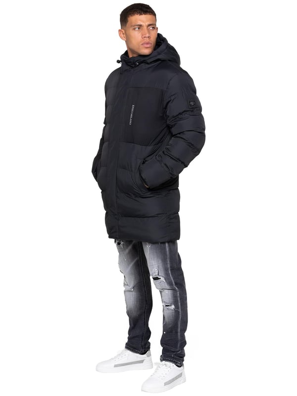 Stay warm and protected with the Enzo Milano Men’s Longline Puffer Jacket, crafted from smooth water-resistant poly fabric and insulated with synthetic fill for lasting comfort. Designed with a detachable faux fur trim and a faux fur-lined hood. The chest print and signature metal badge on the arm add premium detailing, while multiple zip pockets – including waist, chest, and inner options – keep your essentials secure. A drawcord hood with adjustable toggle, ribbed cuffs, and a full zip fastening with popper buttons provide extra protection against wind and rain, making this longline puffer your ultimate cold-weather essential.