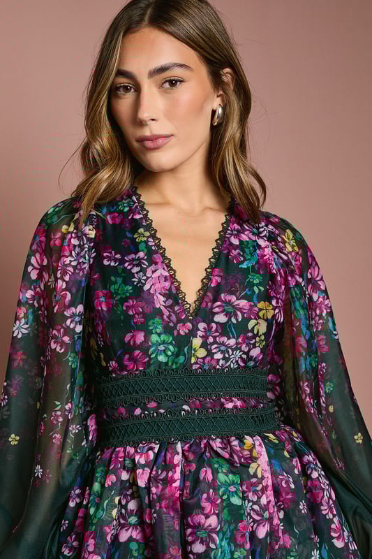 Introducing our stunning dress, crafted from a delightful organza that exudes elegance and charm. The dress features long sleeves, with lace trims.  Made from high-quality print organza, it offers a lightweight and comfortable feel. With its midi lengtha and v neck, this dress is perfect for any occasion, whether it's a wedding or a special birthday. Embrace the beauty of the floral print and make a statement wherever you go with this fabulous dress.