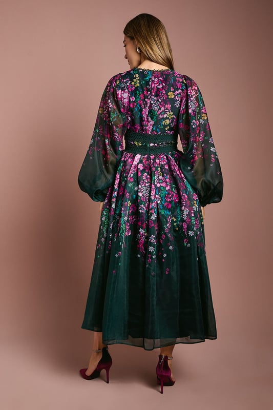Introducing our stunning dress, crafted from a delightful organza that exudes elegance and charm. The dress features long sleeves, with lace trims.  Made from high-quality print organza, it offers a lightweight and comfortable feel. With its midi lengtha and v neck, this dress is perfect for any occasion, whether it's a wedding or a special birthday. Embrace the beauty of the floral print and make a statement wherever you go with this fabulous dress.