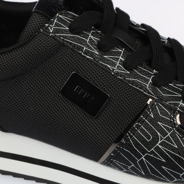 They feature a black and white design with a printed logo pattern and a platform wedge sole. Lace up fastening.Lightly padded insole.Rubber sole.