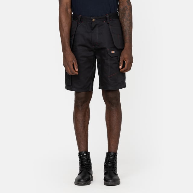 Dickies Shorts REDHAWK PRO SHORTS Rüste deine Arbeitsgarderobe mit unserer Redhawk Pro Short auf. Diese Short mit regulärer Passform verfügt über mehrere Taschen zum Tragen der wichtigsten Arbeitsgegenstände und Platz zum Einsetzen deiner Knieschützer. Ein unverzichtbarer Style mit sauberen Kontrastnähten. Reguläre Passform für den Alltag. Nach unten geöffnete Taschen für deine Knieschützer.