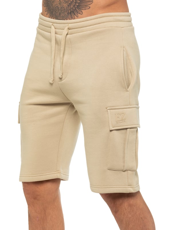 Enzo Mens Cargo Shorts. Features 2 Cargo Pockets and 2 Side Slash Pockets. EZ logo On Pocket. Elasticated Waistband With Adjustable Drawsting.