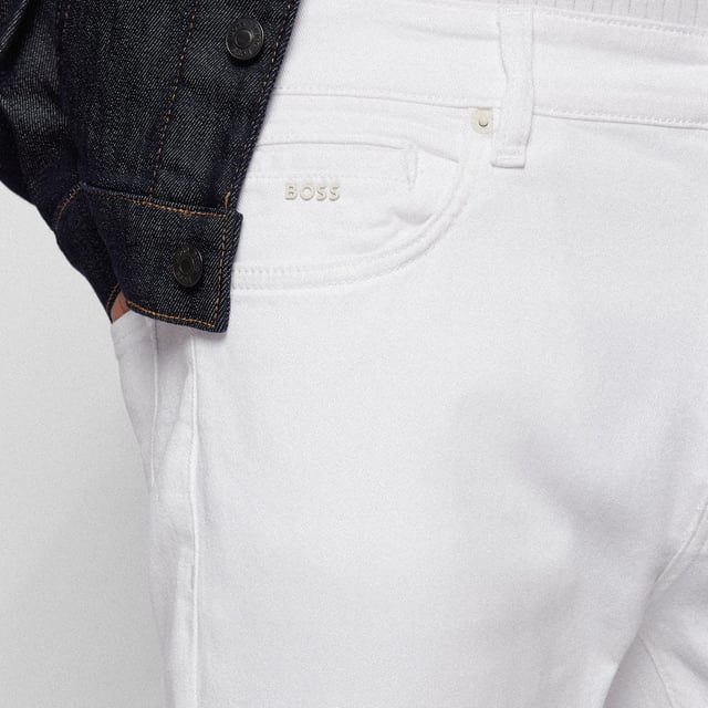 Mens Boss Keith-1 Jeans in natural.- Classic 5 pocket styling.- Zip fly and button fastening.- Belt loops.- Signature branded leather patch at the rear.- Tapered fit.- Ref: 50473984101