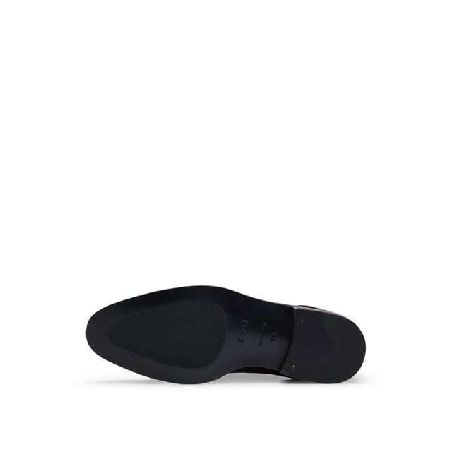 Heren Boss Derrek Monk in bruin Heren BOSS Derrek Monk in bruin.- Bovenwerk in leer.- Dubbele monkstrap met gesp.- Amandelvormige teen.- Gestapelde houten zool.- Ref: 50492226202