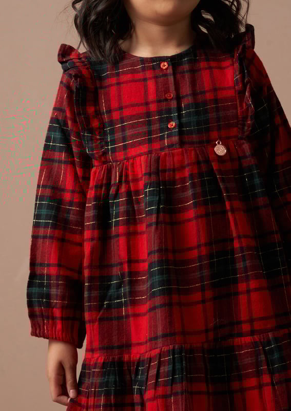 You've never plaid it so good! Look sensational in our tartan dress with cute ruffle detail in an easy to wear sillouette. 