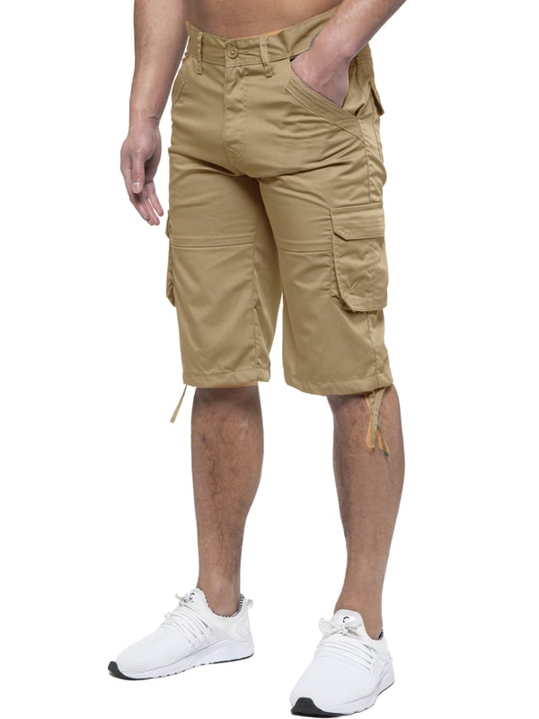 Enzo Mens Cargo Combat Jeans. 7 Pocket Design Including Single Coin Pocket. 2 Front Slash Pockets with Extra Fabric Stitching Detail. 2 Side Cargo Pockets, 2 Back Bellow Pockets with Velcro Fastening Flap. Extra Stitching Details to all Pockets. Adjustable Drawstring to the Hems. Zip Fly Fastening. Premium Quality Fabric Ideal for Casual and Heavy Duty Work Wear.