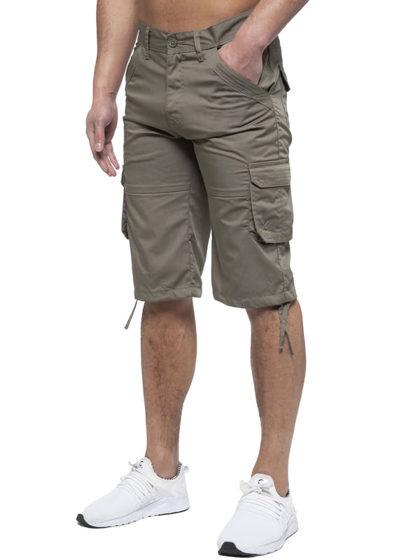 Enzo Mens Cargo Combat Jeans. 7 Pocket Design Including Single Coin Pocket. 2 Front Slash Pockets with Extra Fabric Stitching Detail. 2 Side Cargo Pockets, 2 Back Bellow Pockets with Velcro Fastening Flap. Extra Stitching Details to all Pockets. Adjustable Drawstring to the Hems. Zip Fly Fastening. Premium Quality Fabric Ideal for Casual and Heavy Duty Work Wear.
