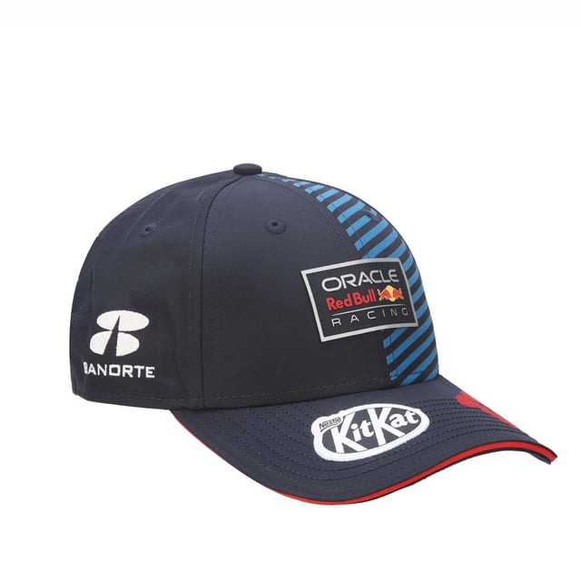 New Era Red Bull Racing Sergio Perez 9FORTY Cap in blue.- Adjustable strap at the back.- Curved brim.- New Era logo is proudly displayed on the front of the cap  highlighting the brand's iconic  timeless design.- Lightweight and breathable.- 100% Cotton.- Ref: 60504672