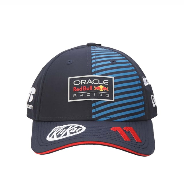 New Era Red Bull Racing Sergio Perez 9FORTY Cap in blue.- Adjustable strap at the back.- Curved brim.- New Era logo is proudly displayed on the front of the cap  highlighting the brand's iconic  timeless design.- Lightweight and breathable.- 100% Cotton.- Ref: 60504672