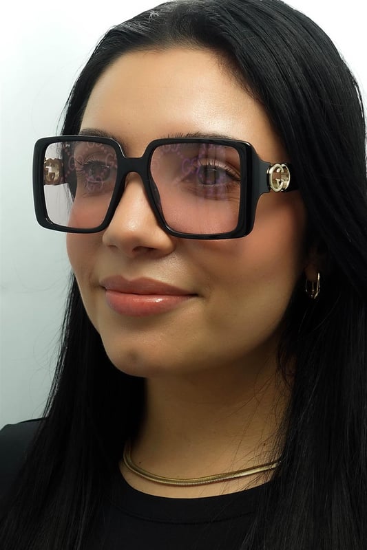 Gucci Square Womens Black with Gold Dusky Pink w Logo Mirror Photochromic GG1692S  Sunglasses feature a striking, oversized frame with a unique, softly contoured shape that enhances any look with a touch of glamour. Embellished with the iconic double-G logo on the temples, the GG1692S model proudly showcases the essence of Gucciâ€™s timeless style. The high quality lenses ensure exceptional UV protection, making them as practical as they are stylish. Available in a variety of refined colors, these sunglasses are the perfect choice for those who seek to combine bold elegance with modern fashion sensibilities.
