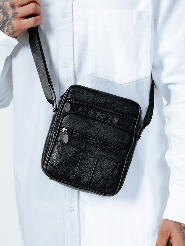 Crafted from wear-resistant genuine leather, this crossbody messenger bag is built to last. Featuring multiple compartments for easy organization and a soft cotton lining, it offers both durability and style. The adjustable strap ensures a comfortable, customizable fit for all-day wear. H:22cm L:18cm W:8cm SKU:HB350802