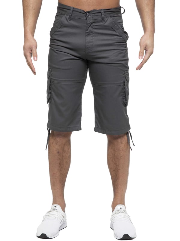 Enzo Mens Cargo Combat Jeans. 7 Pocket Design Including Single Coin Pocket. 2 Front Slash Pockets with Extra Fabric Stitching Detail. 2 Side Cargo Pockets, 2 Back Bellow Pockets with Velcro Fastening Flap. Extra Stitching Details to all Pockets. Adjustable Drawstring to the Hems. Zip Fly Fastening. Premium Quality Fabric Ideal for Casual and Heavy Duty Work Wear.