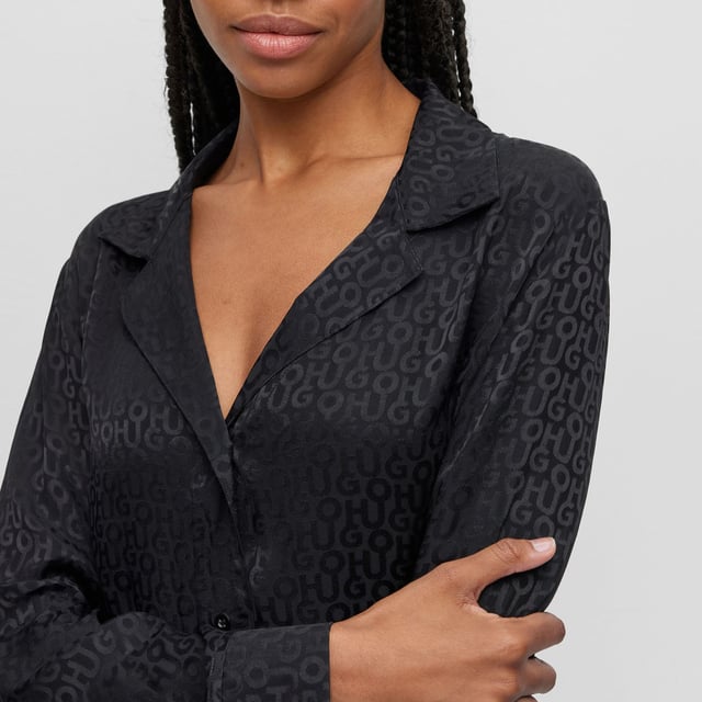 Womens Hugo Satinoir Pyjamas in black.- Spread collar.- Long sleeves with button cuffs.- Ful button fastening.- Elasticated waistband.- Ref: 50484438001